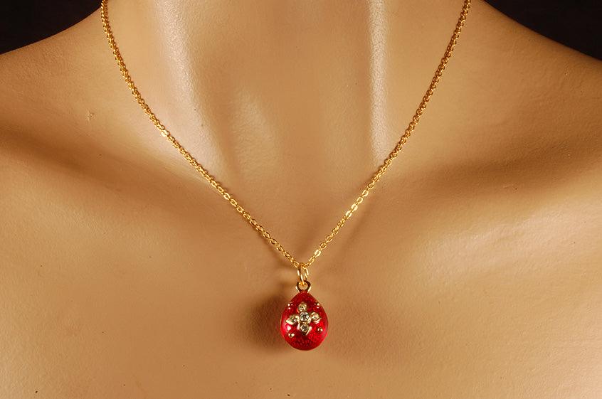 Russian Fabergé egg pendant with red enamel and features crystals.